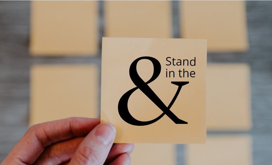 Stand in the & Sticky note